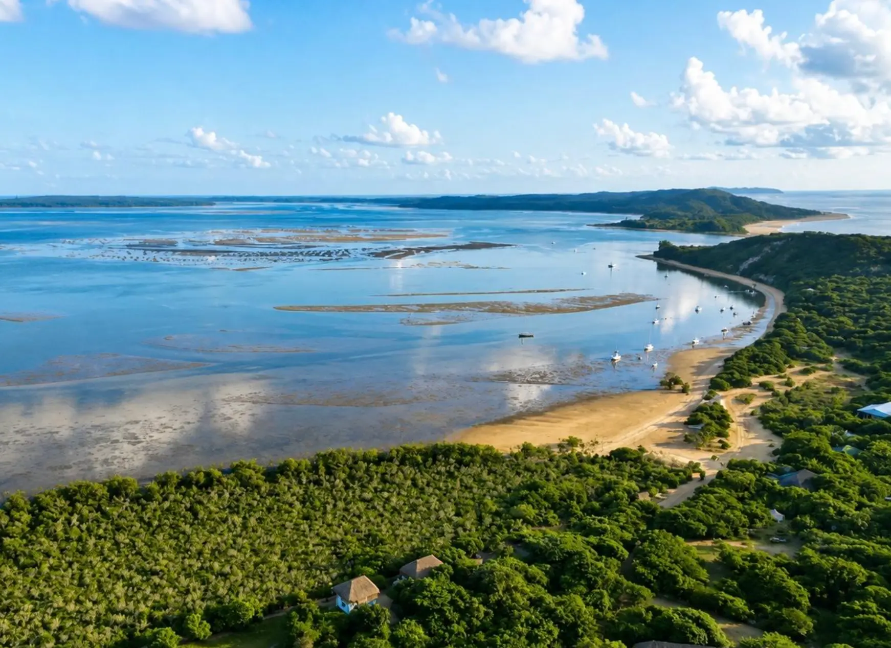 Aerial view over Santa Maria Bay with turquoise water along the Bemugi's shoreline